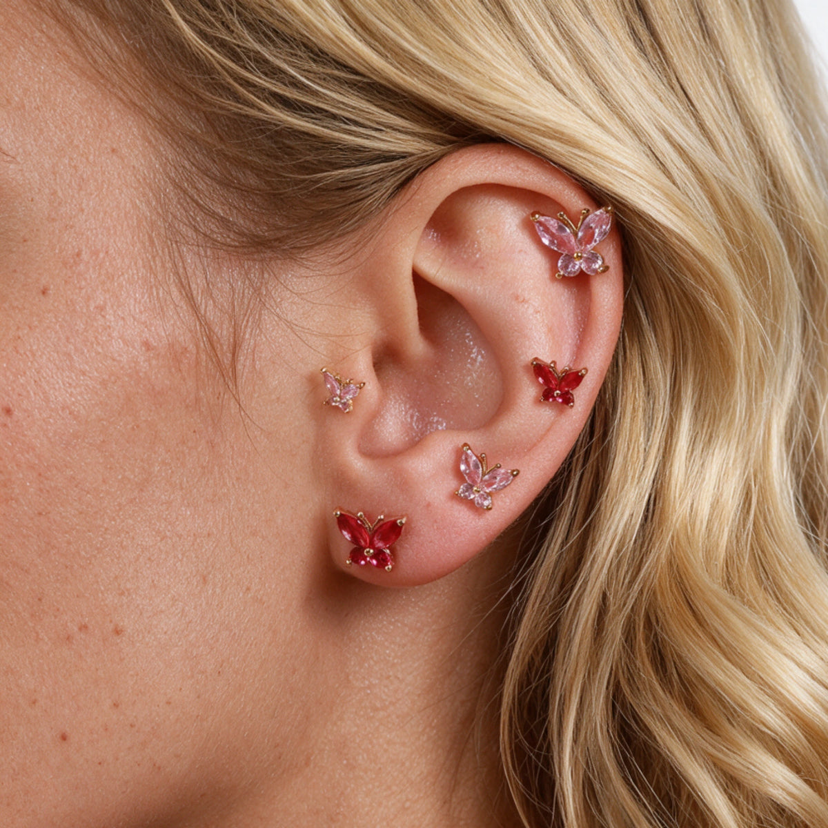 Piercing a bilanciere con farfalla rosa (20G)