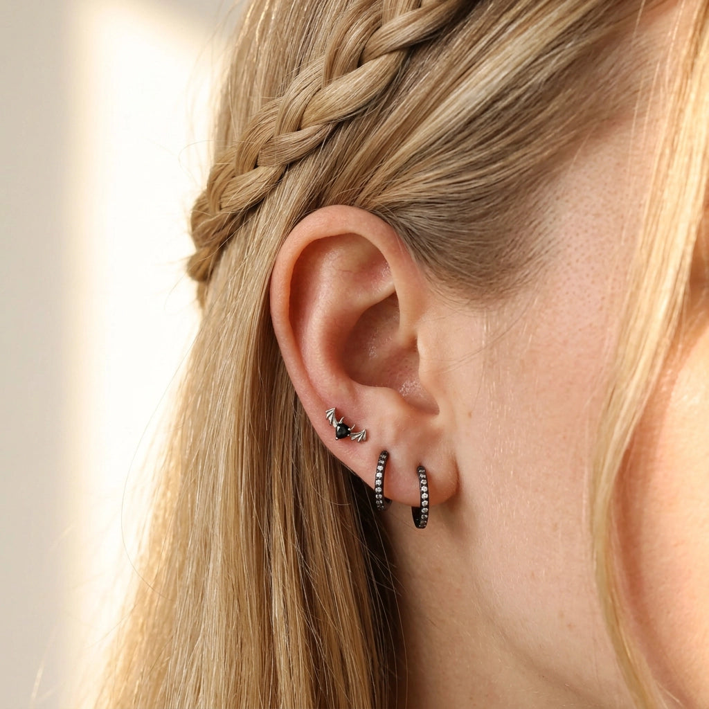 Titanium Hreremus Black Spinel Bat Stud