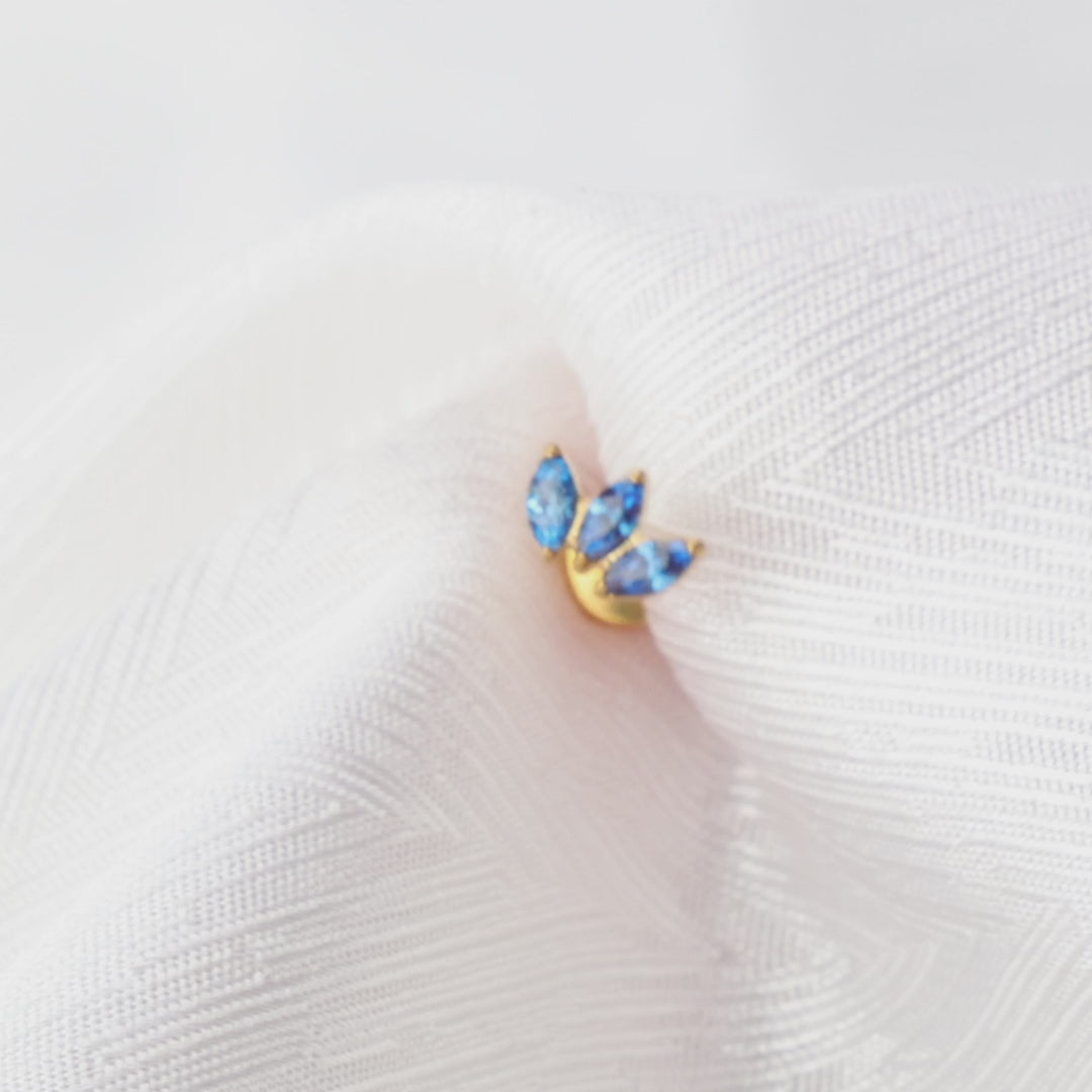 Load video: Myla Blue Sapphire Three-Petal Flat Back Stud