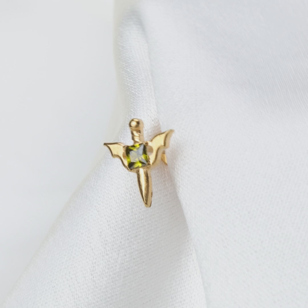 Load video: Titanium Clio Little Peridot Sword Flat Back Stud