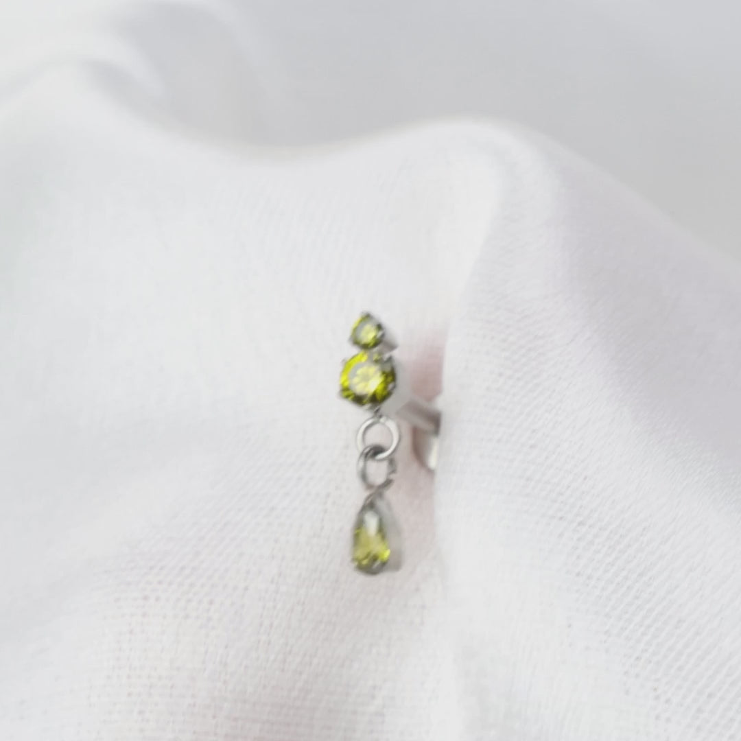 Load video: Titanium Yuri Waterdrop Push Pin Stud - Peridot