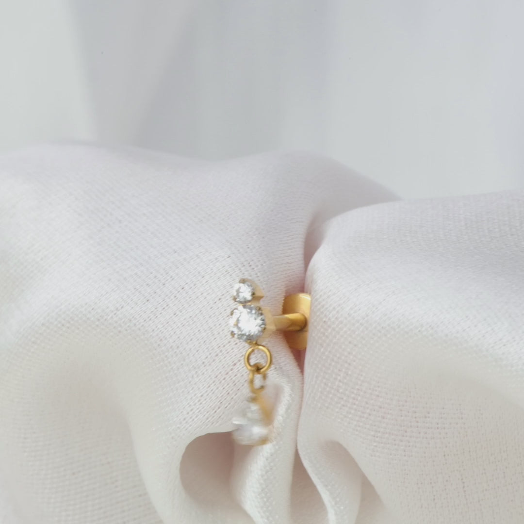 Load video: Titanium Yuri Waterdrop Push Pin Stud - White Crystal